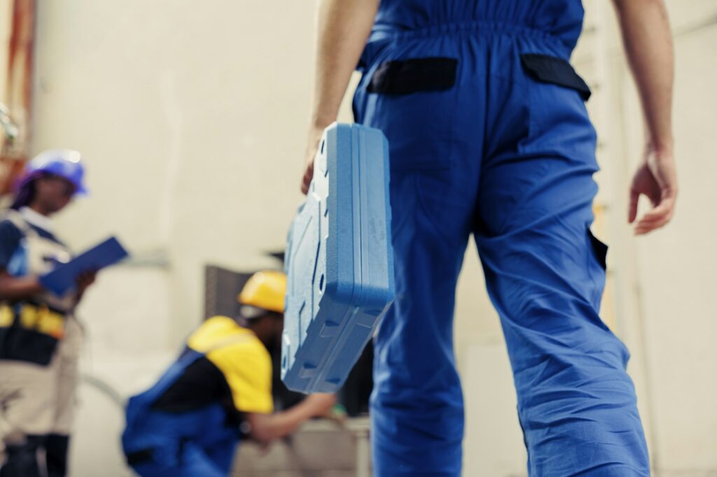 Technicians repairing air conditioner